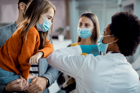 Emergency physician with patient and family