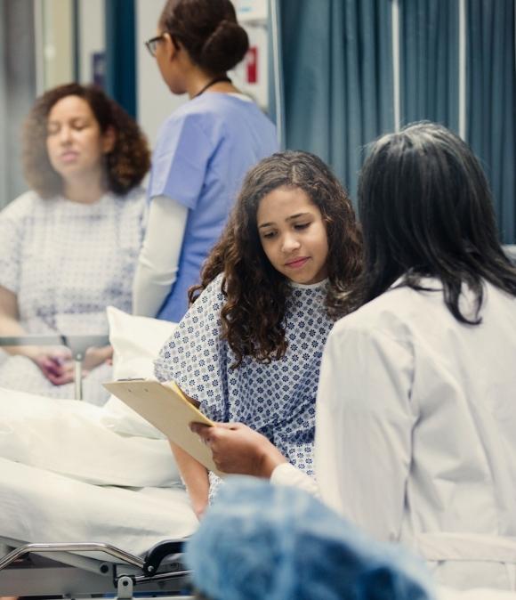 Emergency medicine image of doctor speaking with young patient